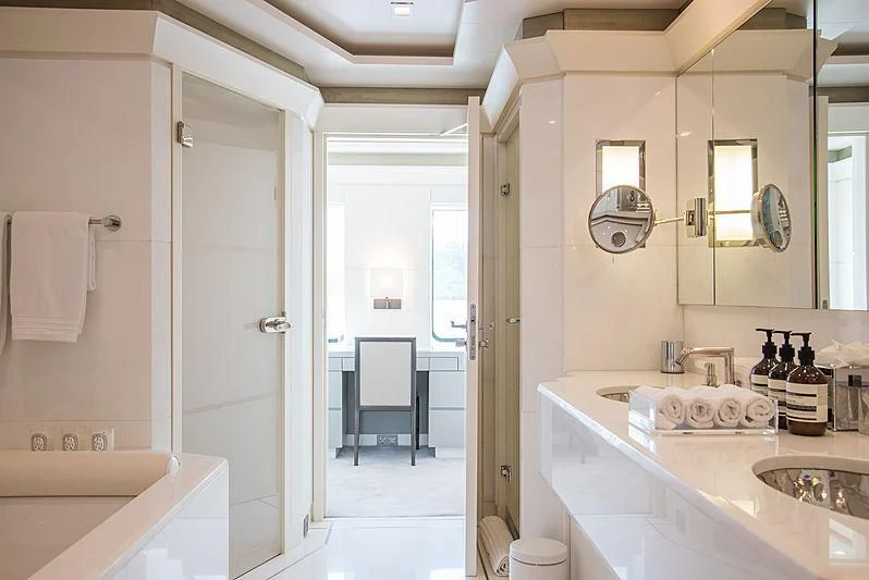 a bathroom with a sink and a shower aboard TRIPLE SEVEN Yacht for Sale