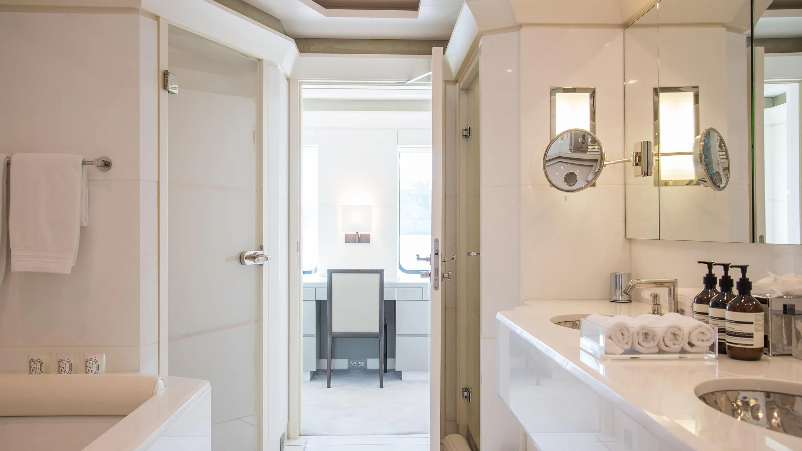 a bathroom with a sink and a mirror aboard TRIPLE SEVEN Yacht for Sale