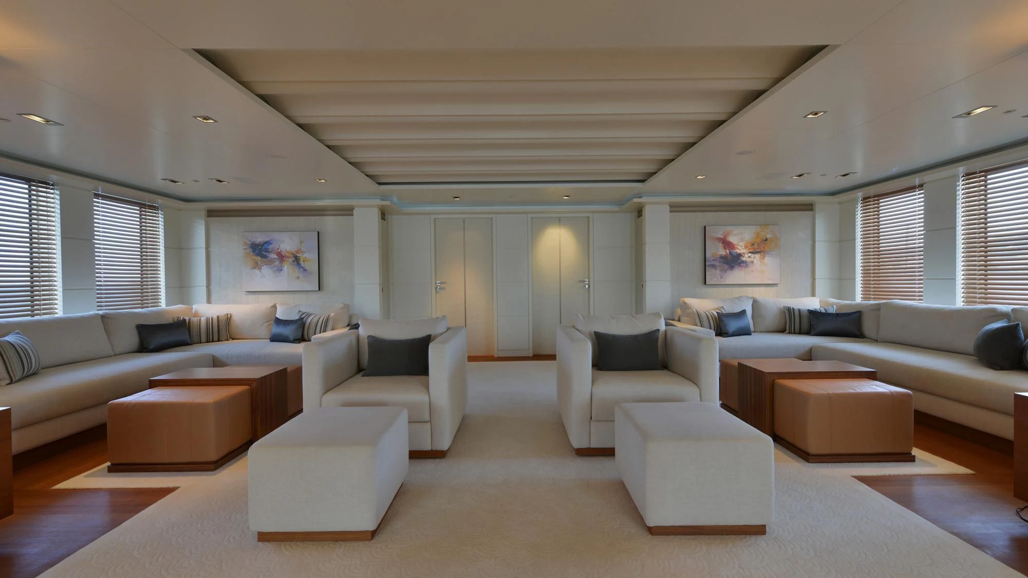 a living room with white furniture aboard TRIPLE SEVEN Yacht for Sale