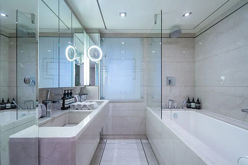 a bathroom with a tub sink and sinks aboard TRIPLE SEVEN Yacht for Sale