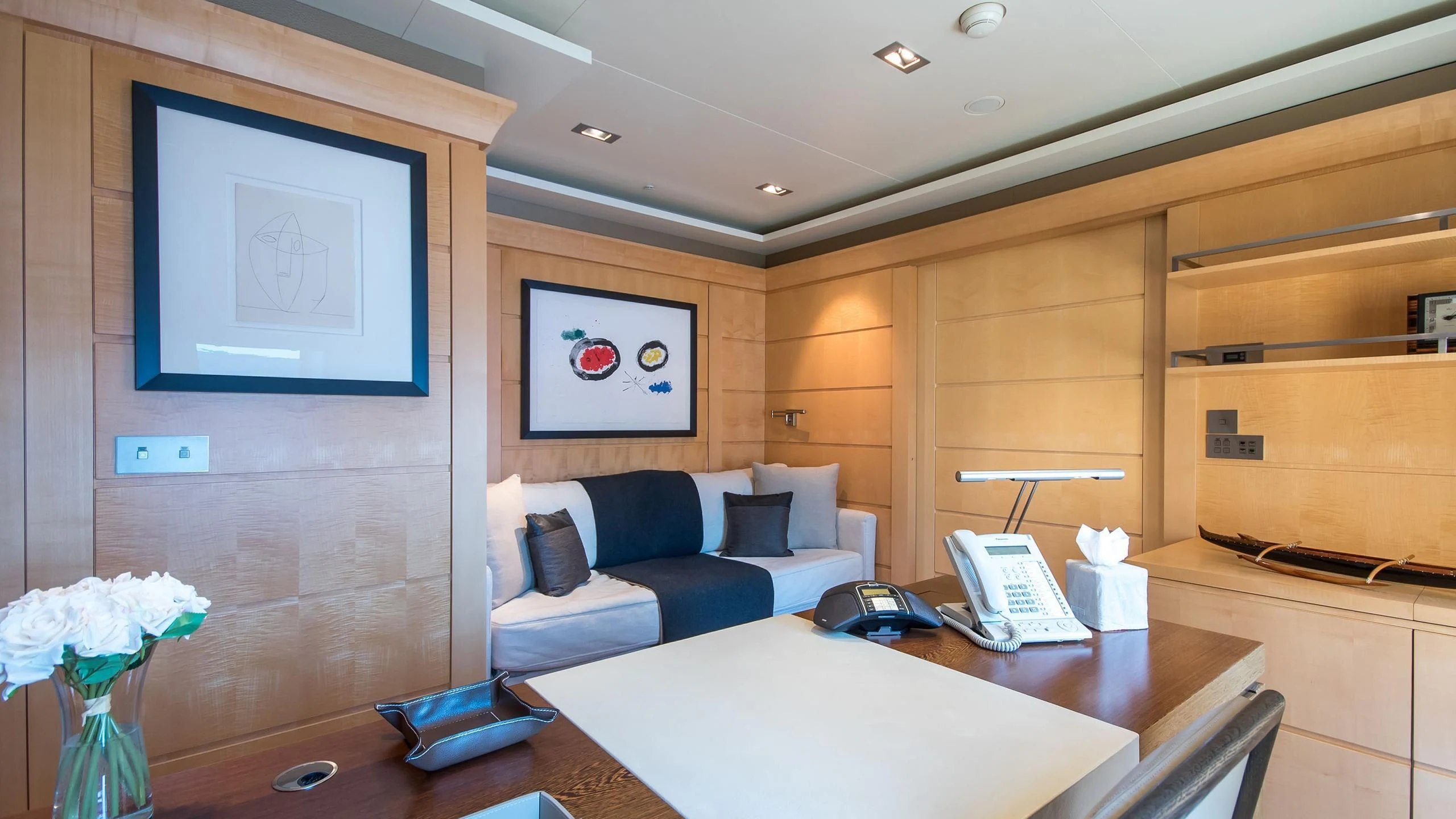 a room with a desk and a bed aboard TRIPLE SEVEN Yacht for Sale