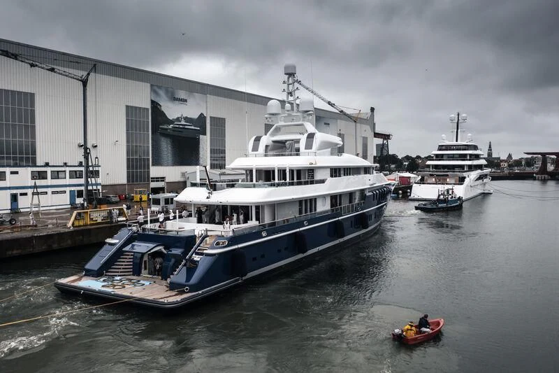 a large boat docked at a pier aboard TRIPLE SEVEN Yacht for Sale