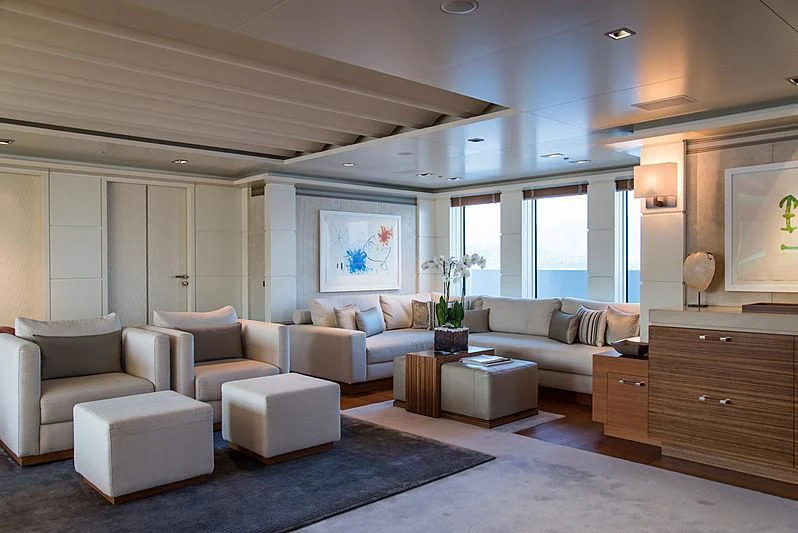 a living room with white furniture aboard TRIPLE SEVEN Yacht for Sale