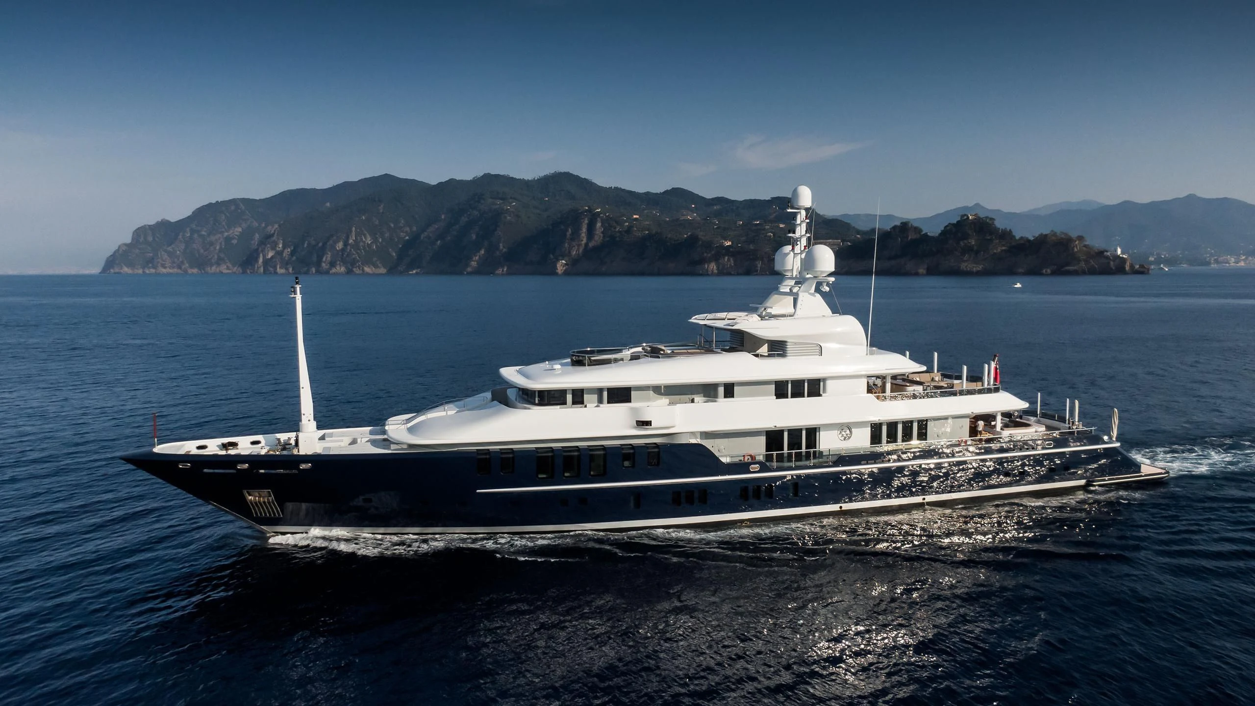 a large white ship on the water aboard TRIPLE SEVEN Yacht for Sale
