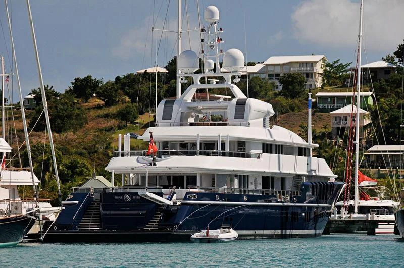 a large white boat in the water aboard TRIPLE SEVEN Yacht for Sale