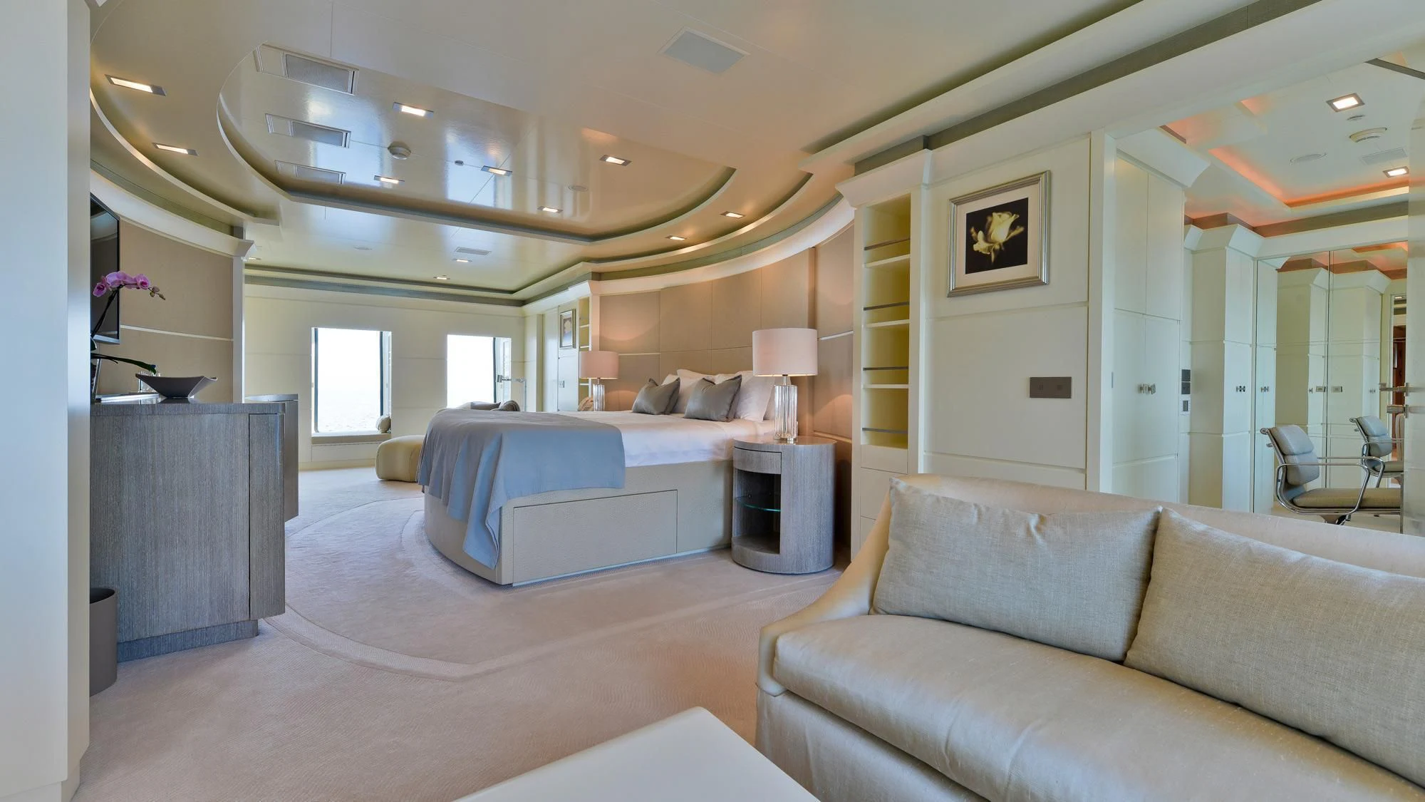 a living room with a couch and a bed aboard TRIPLE SEVEN Yacht for Sale