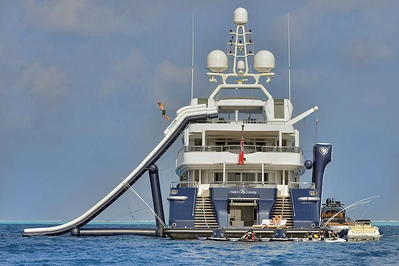 a large white ship in the water aboard TRIPLE SEVEN Yacht for Sale