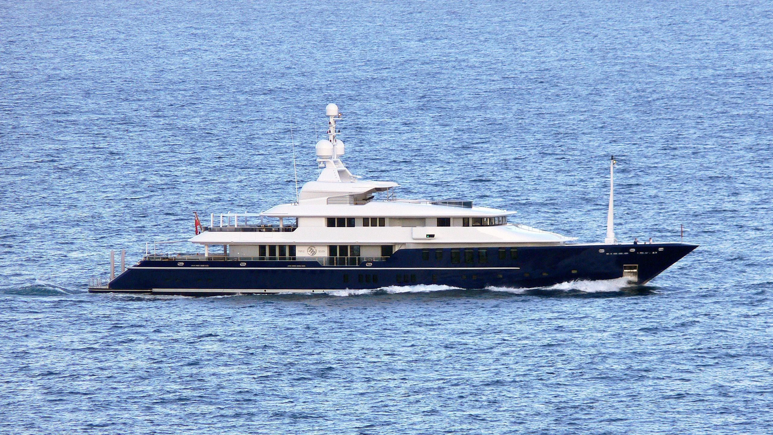 a large boat in the water aboard TRIPLE SEVEN Yacht for Sale