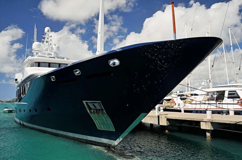 a couple of large boats in the water aboard TRIPLE SEVEN Yacht for Sale