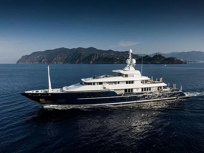 a large white boat in the water aboard TRIPLE SEVEN Yacht for Sale