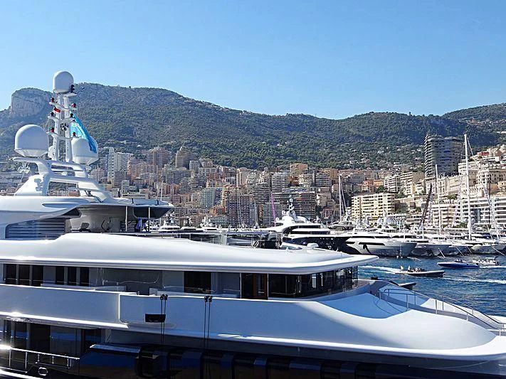 a large ship docked at a port aboard TRIPLE SEVEN Yacht for Sale