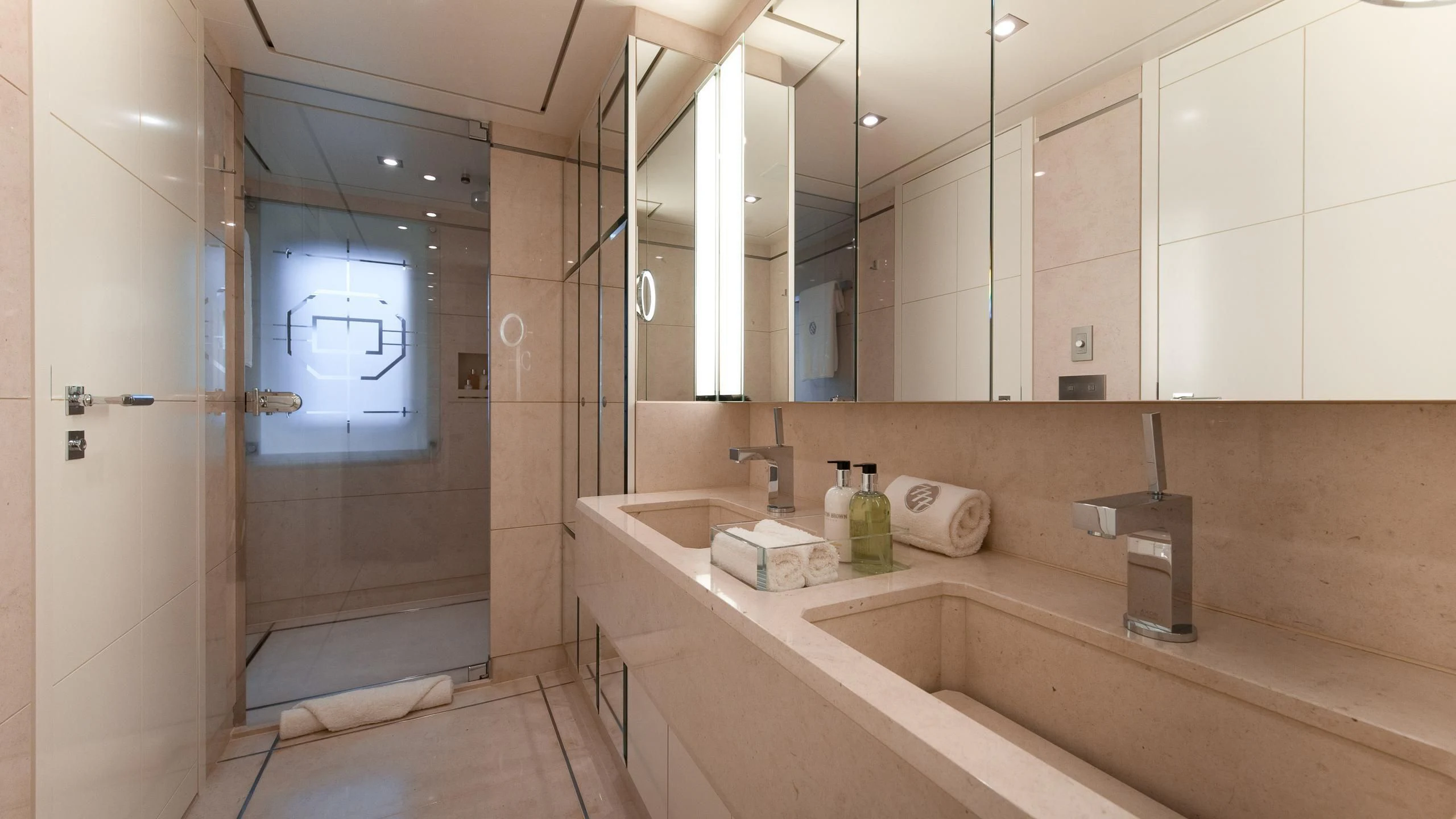 a bathroom with a large mirror aboard TRIPLE SEVEN Yacht for Sale