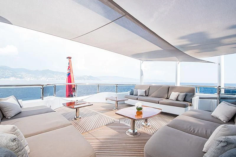 a living room with a large window aboard TRIPLE SEVEN Yacht for Sale