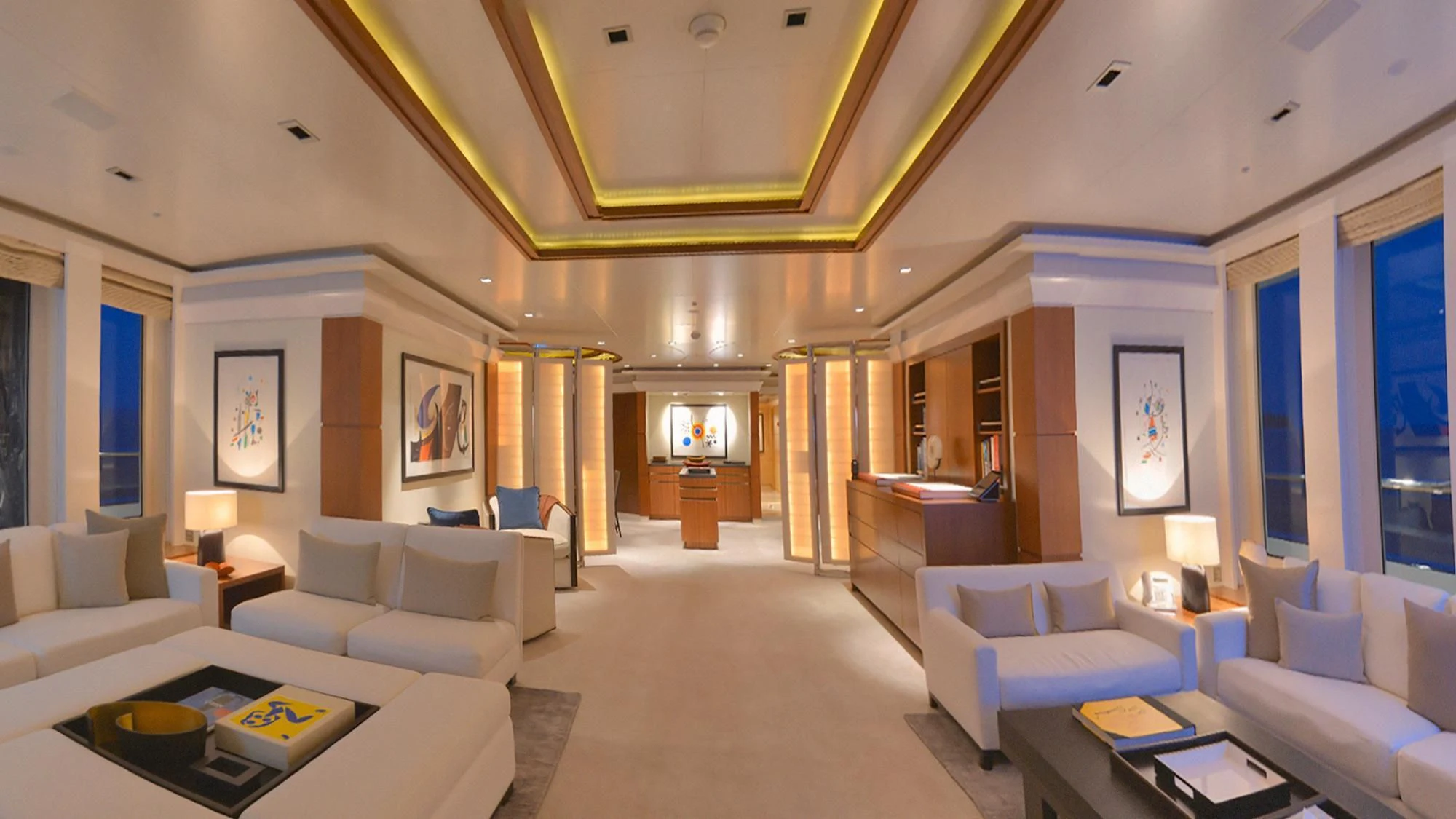 a living room with a fireplace aboard TRIPLE SEVEN Yacht for Sale