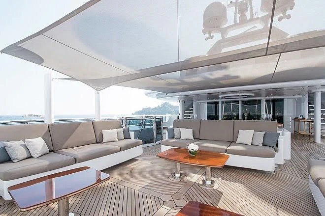 a living room with a large open window aboard TRIPLE SEVEN Yacht for Sale