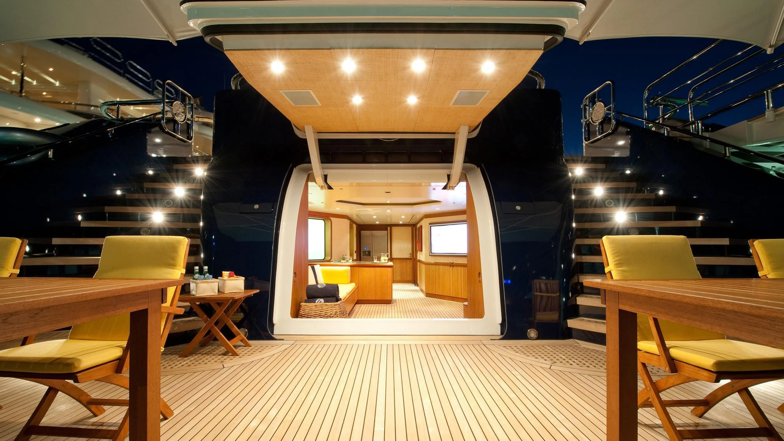 a room with tables and chairs aboard TRIPLE SEVEN Yacht for Sale