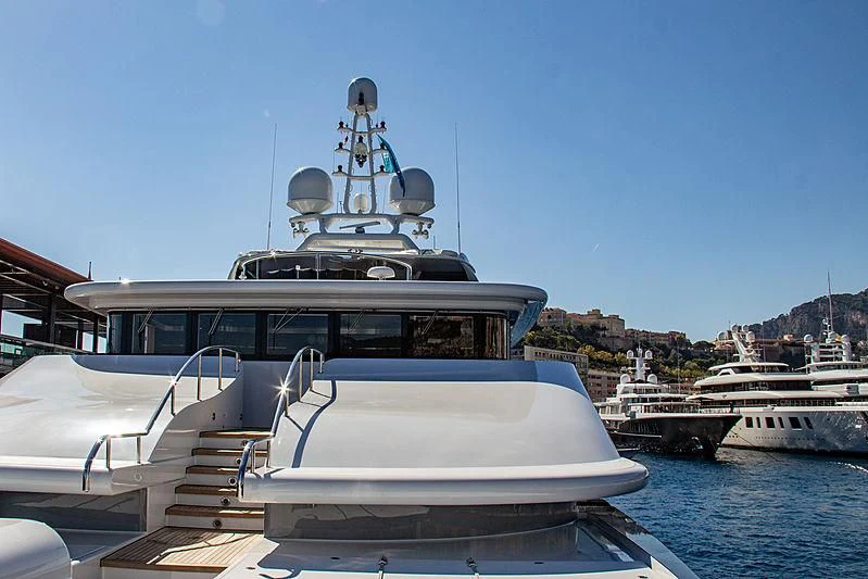 a boat with a helicopter on it aboard TRIPLE SEVEN Yacht for Sale
