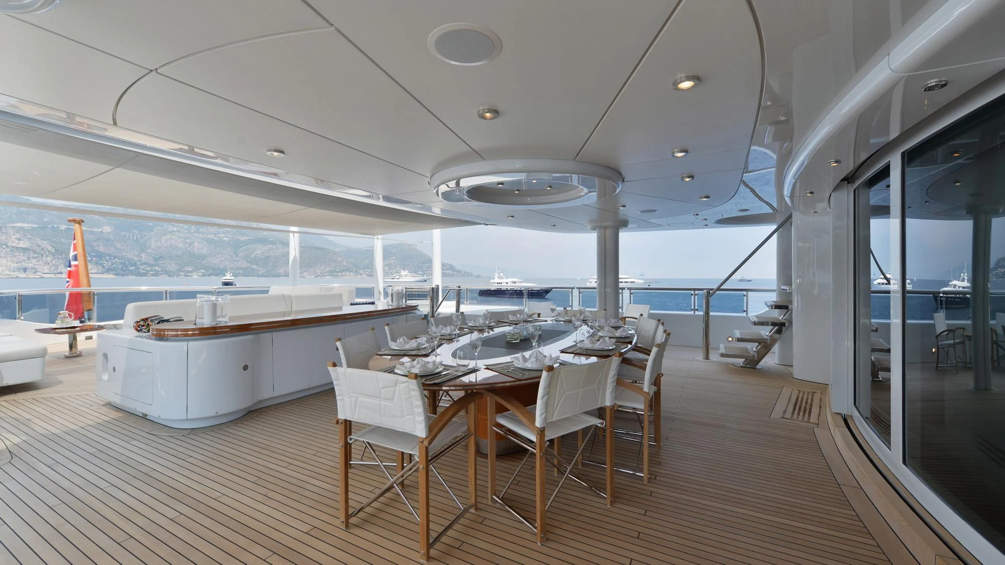 a room with tables and chairs aboard TRIPLE SEVEN Yacht for Sale