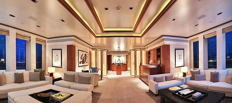 a living room with a fireplace aboard TRIPLE SEVEN Yacht for Sale