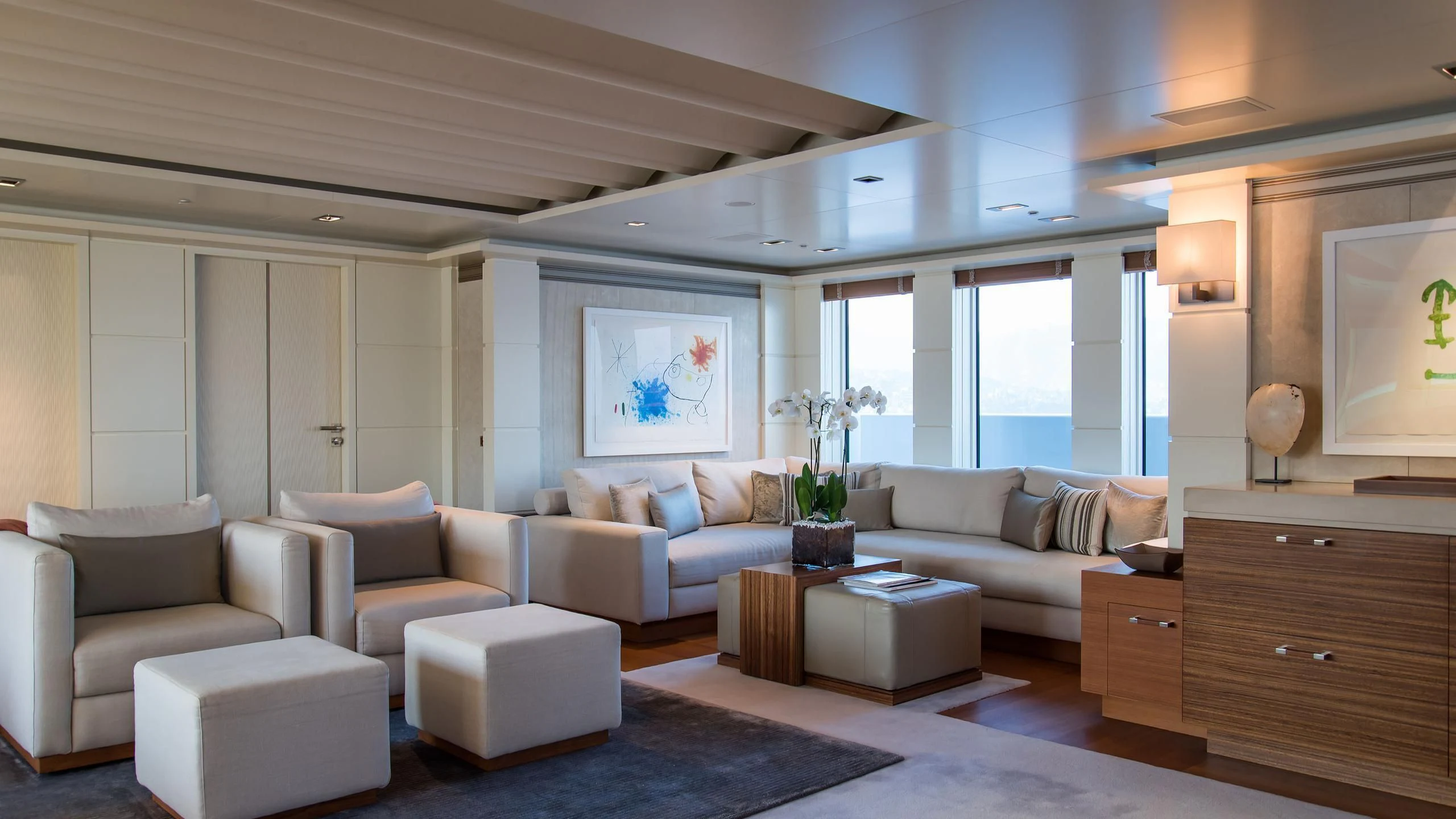 a living room with white furniture aboard TRIPLE SEVEN Yacht for Sale