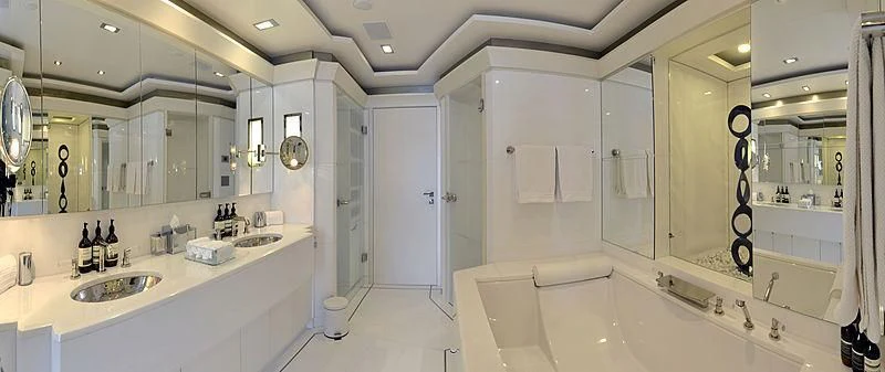 a bathroom with a bathtub sink and sinks aboard TRIPLE SEVEN Yacht for Sale
