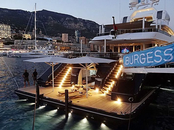 a dock with boats and people on it aboard TRIPLE SEVEN Yacht for Sale