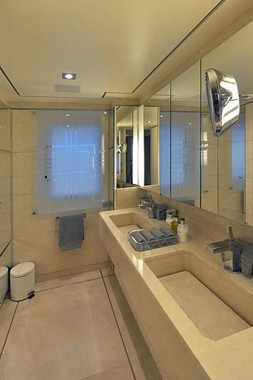 a bathroom with a large mirror aboard TRIPLE SEVEN Yacht for Sale