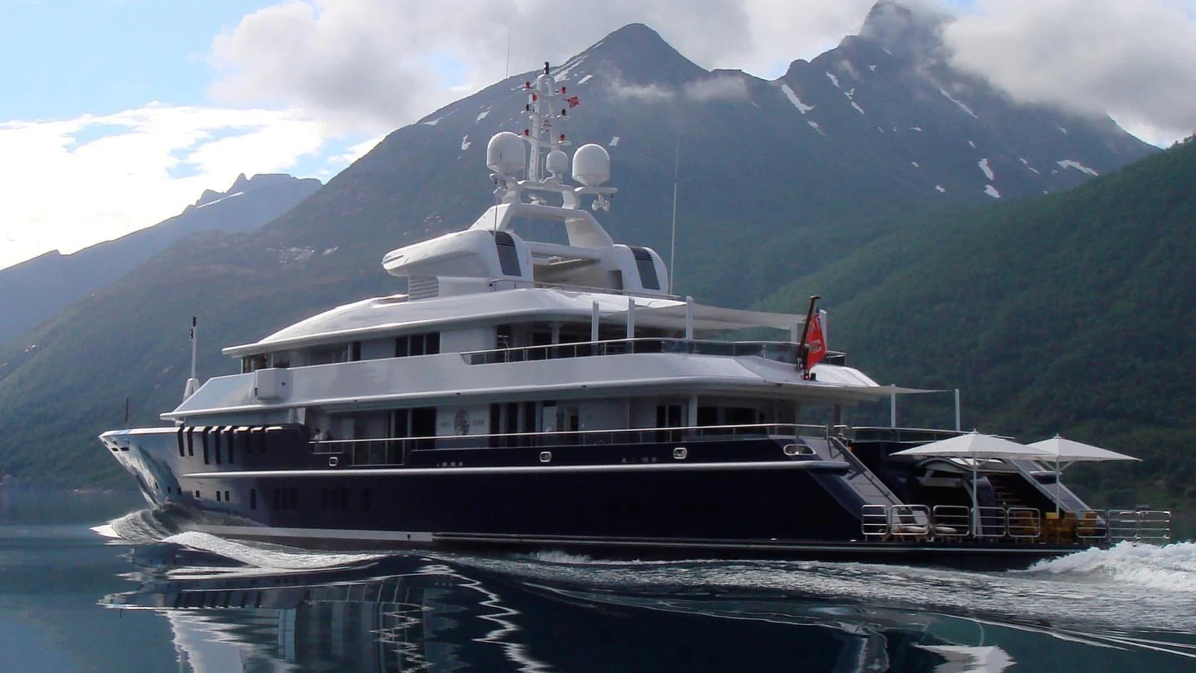 a large cruise ship in the water aboard TRIPLE SEVEN Yacht for Sale