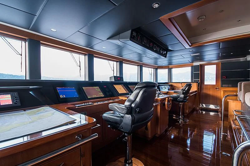 a room with chairs and tables aboard TRIPLE SEVEN Yacht for Sale