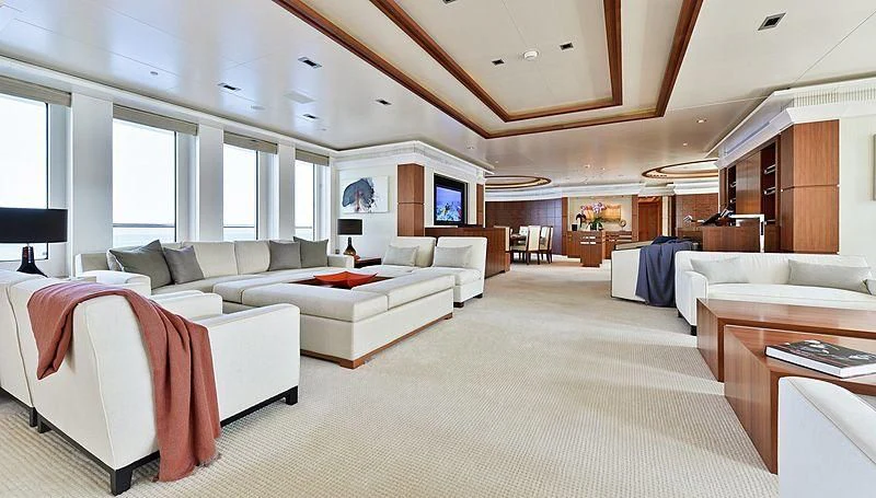 a large room with a bed and a couch aboard TRIPLE SEVEN Yacht for Sale