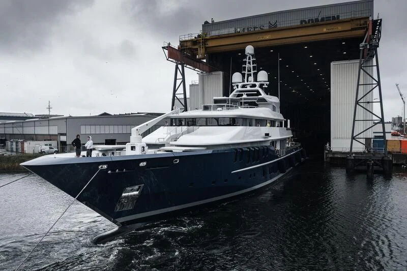 a large white boat docked aboard TRIPLE SEVEN Yacht for Sale