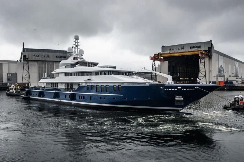 a large white boat in the water aboard TRIPLE SEVEN Yacht for Sale