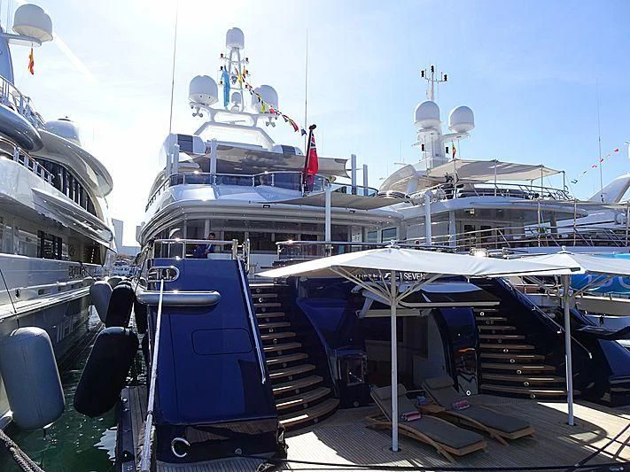 a boat docked at a pier aboard TRIPLE SEVEN Yacht for Sale