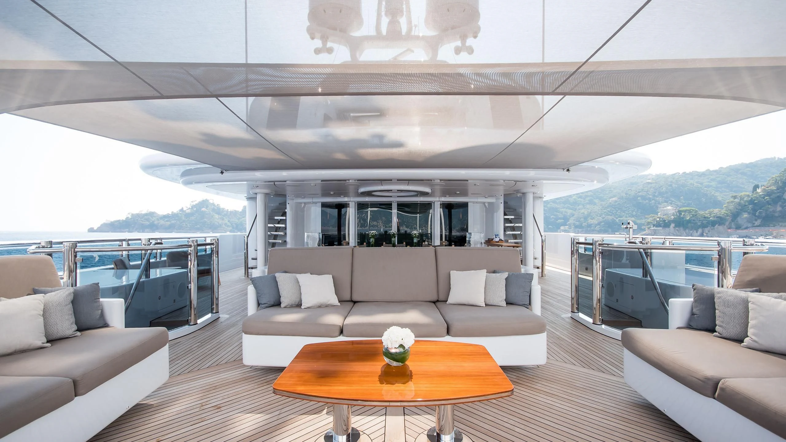 a living room with a large balcony aboard TRIPLE SEVEN Yacht for Sale