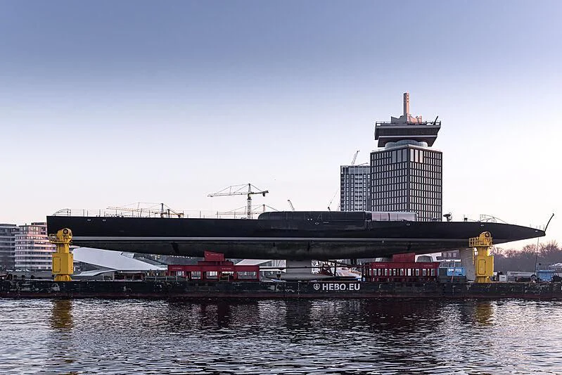 a large black bridge with a red and white train on it aboard ANATTA Yacht for Sale