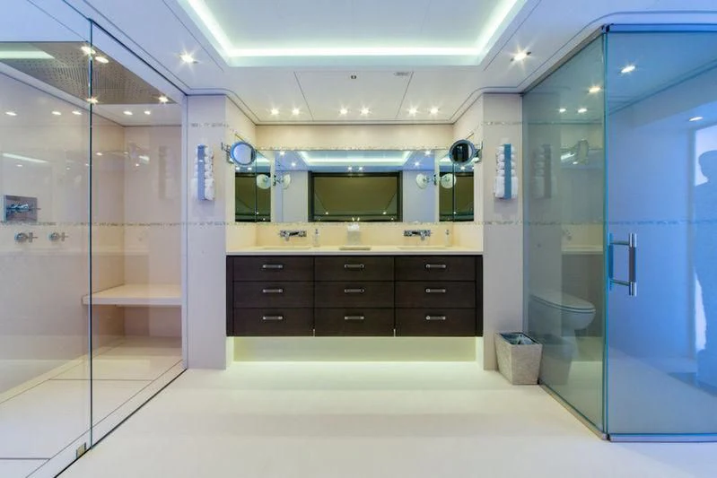 a bathroom with a large mirror aboard ANATTA Yacht for Sale
