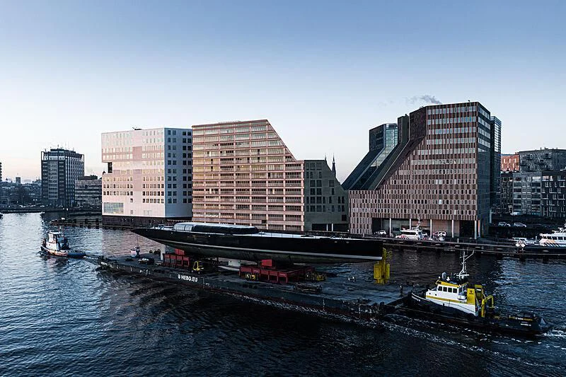 a tugboat pulling a barge aboard ANATTA Yacht for Sale