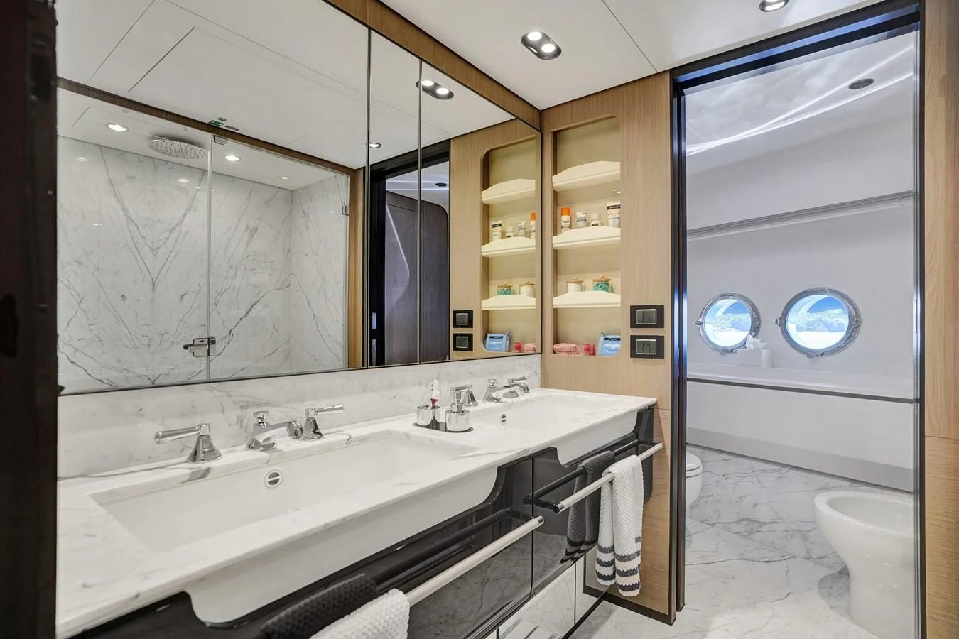 a bathroom with a large mirror aboard ENCHANTE Yacht for Sale