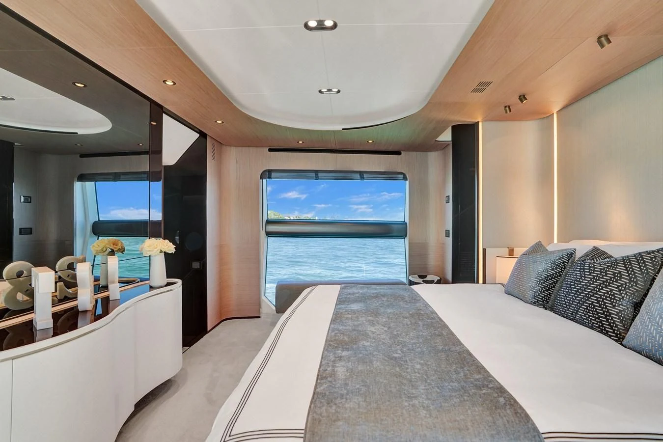 a room with a bed and a window aboard ENCHANTE Yacht for Sale