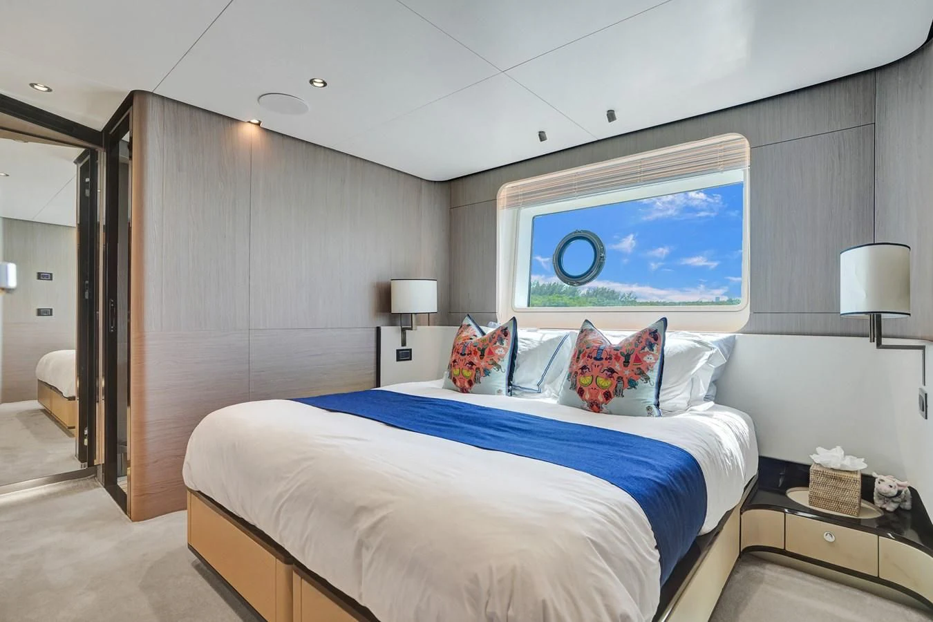 a bedroom with a large bed aboard ENCHANTE Yacht for Sale