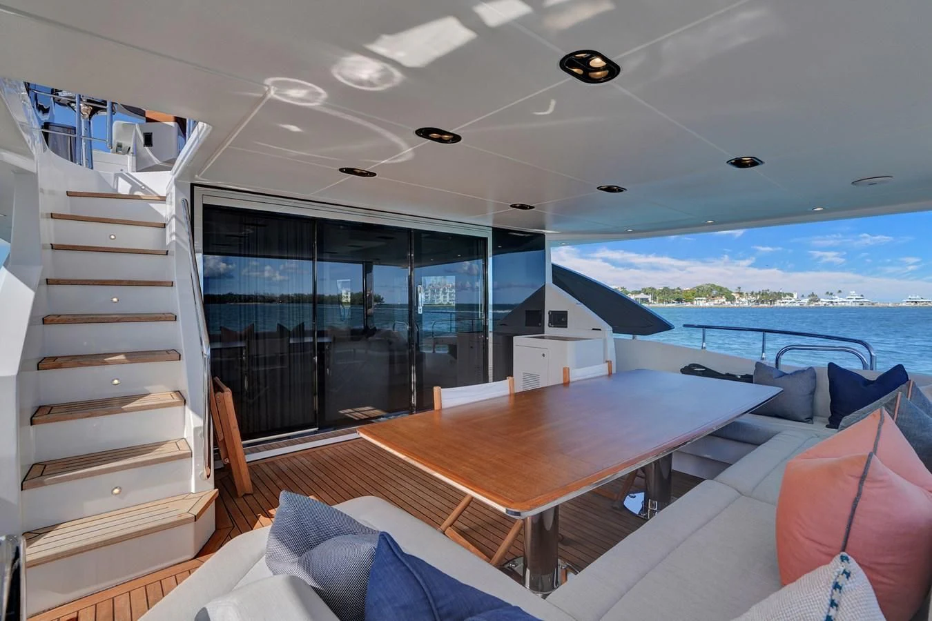 a room with a table and a bed aboard ENCHANTE Yacht for Sale