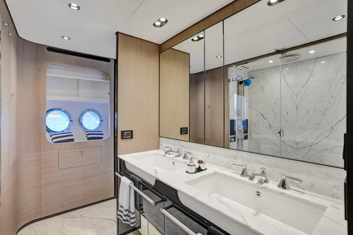 a bathroom with two sinks aboard ENCHANTE Yacht for Sale