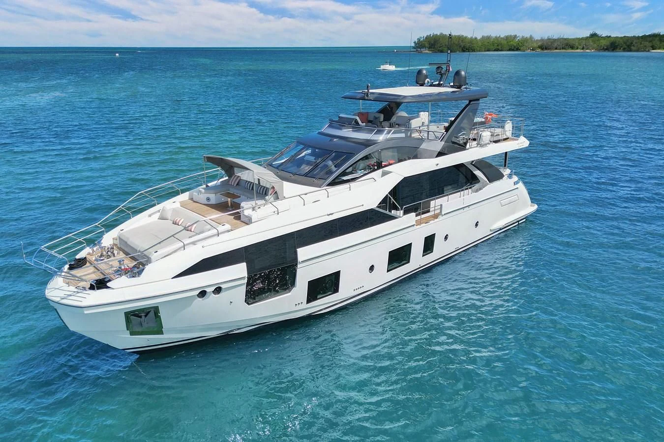 a white yacht in the water aboard ENCHANTE Yacht for Sale
