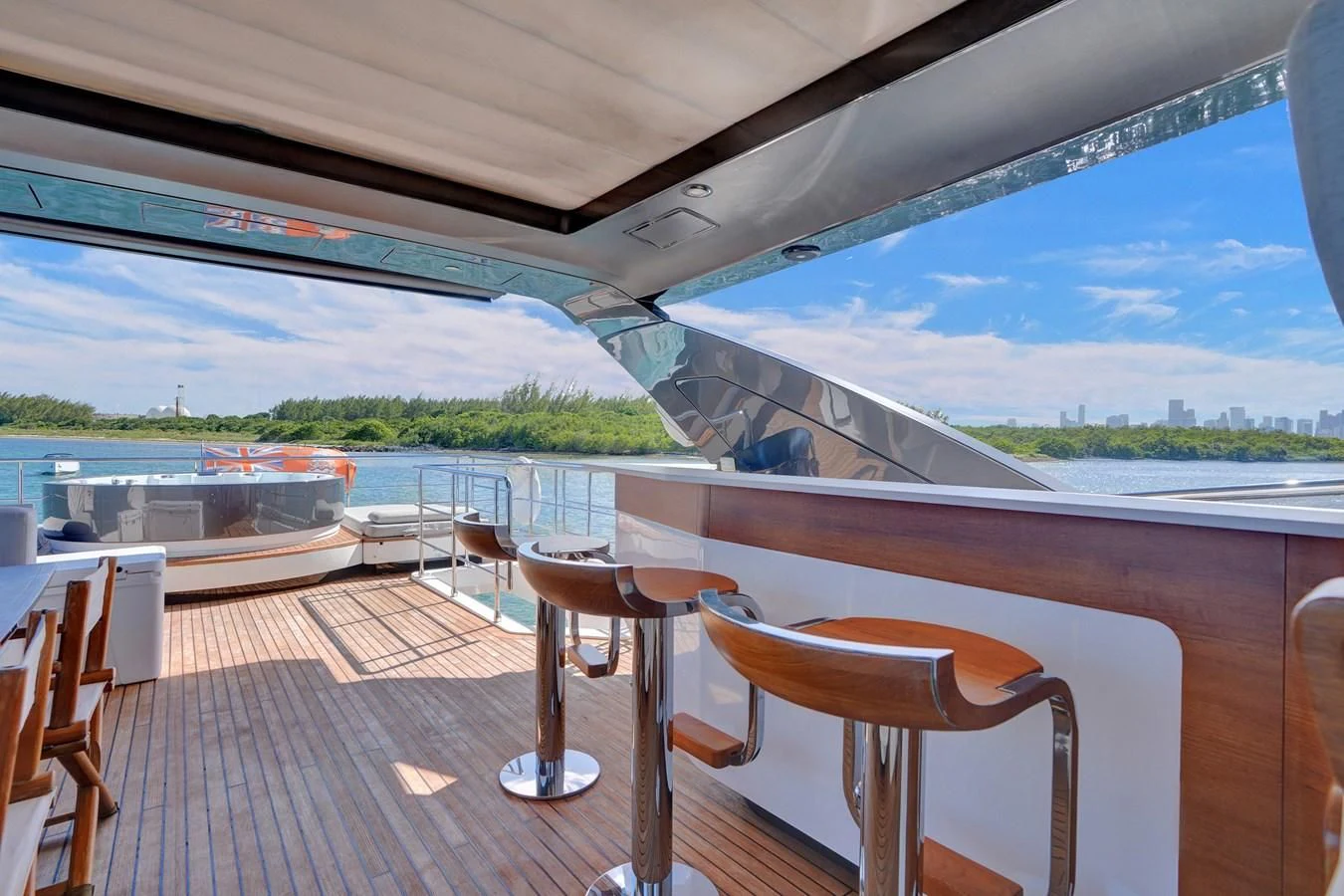 a table and chairs on a deck aboard ENCHANTE Yacht for Sale