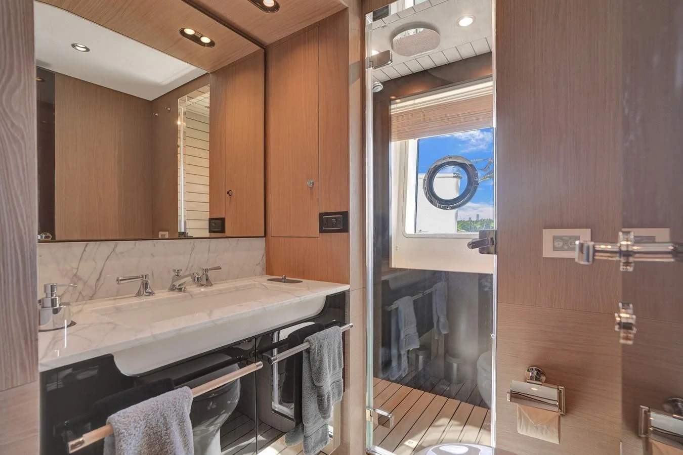 a bathroom with a sink and mirror aboard ENCHANTE Yacht for Sale
