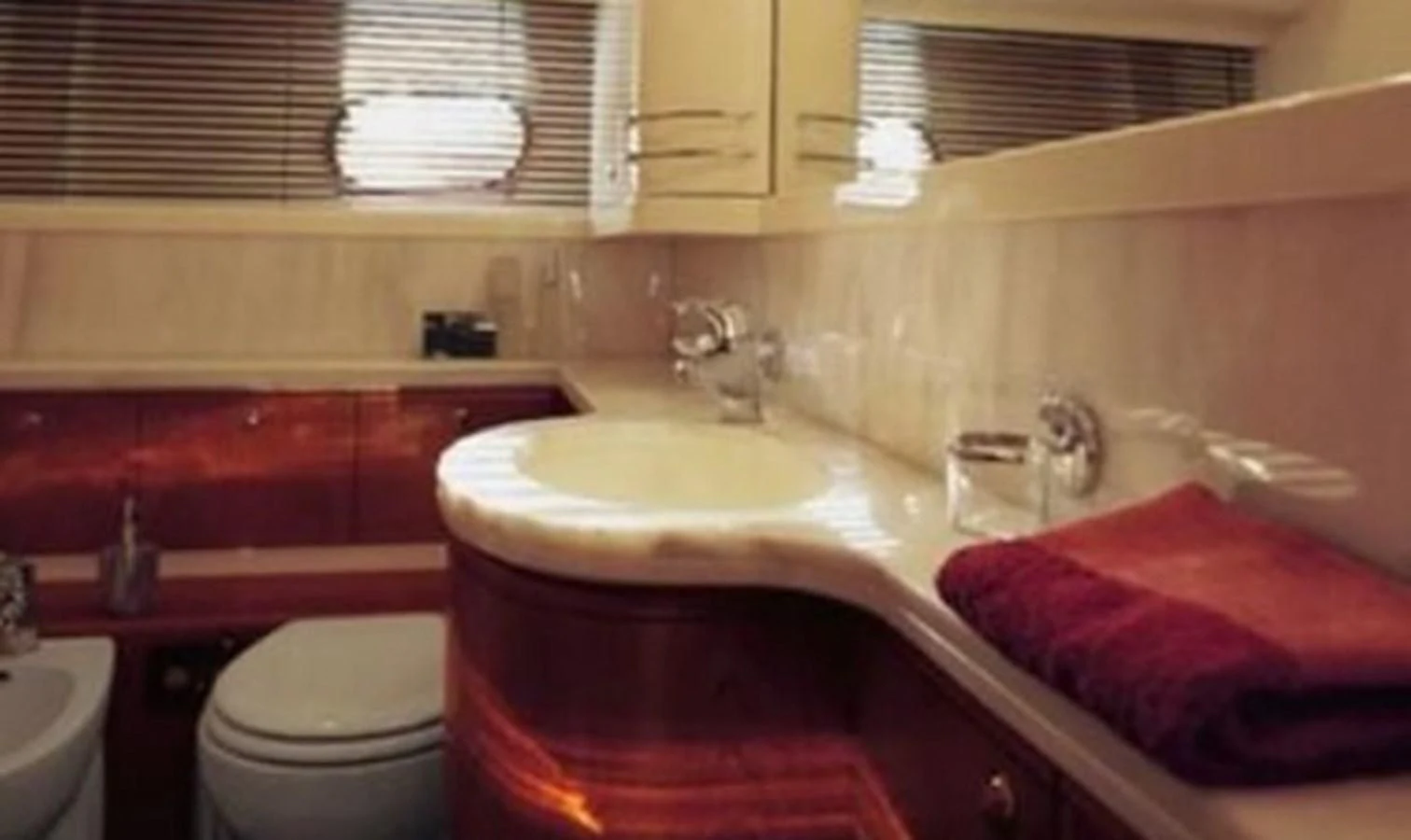 a bathroom with a sink and a toilet aboard DELMARE Yacht for Sale