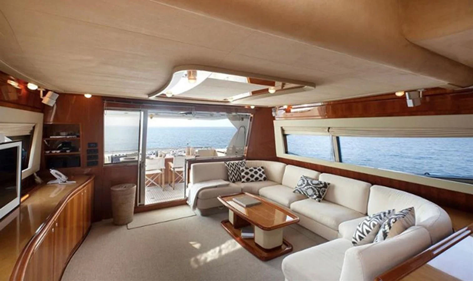 a living room with a large pool aboard DELMARE Yacht for Sale