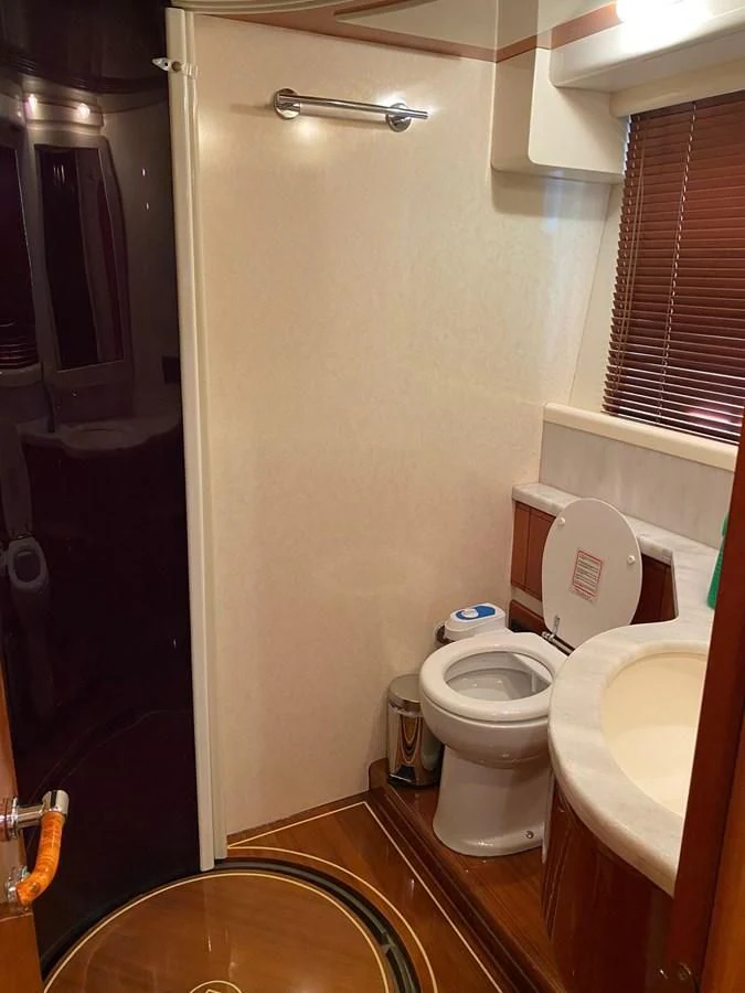 a bathroom with a toilet and sink aboard DELMARE Yacht for Sale