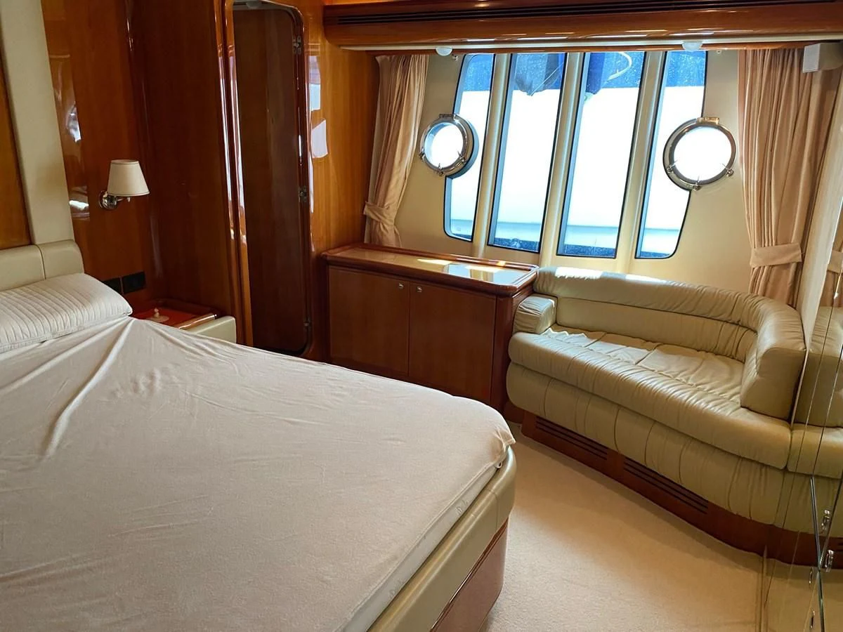 a room with a bed and a couch aboard DELMARE Yacht for Sale