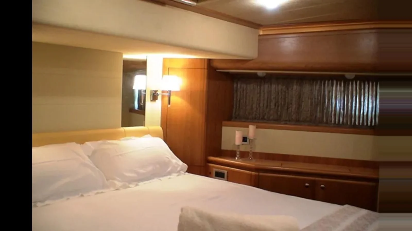 a room with a bed and a window aboard DELMARE Yacht for Sale